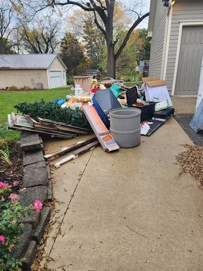 Dumpster being loaded with debris for 3 Yard Dumpster Rental in Vidalia